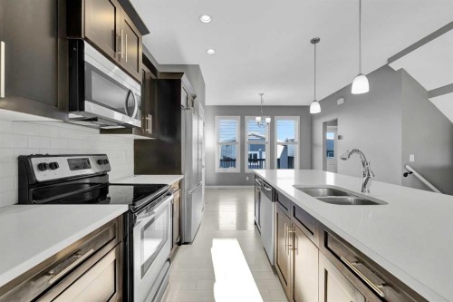 166 Marquis Heights Se, Calgary, AB - Indoor Photo Showing Kitchen With Double Sink With Upgraded Kitchen