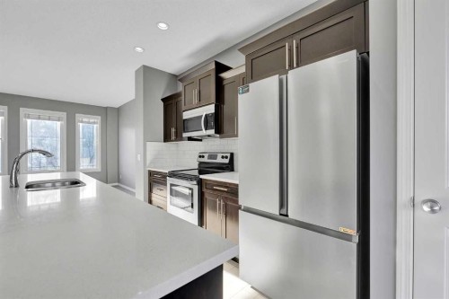 166 Marquis Heights Se, Calgary, AB - Indoor Photo Showing Kitchen With Upgraded Kitchen