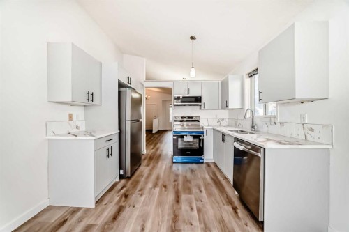 16218 Shawbrooke Road Sw, Calgary, AB - Indoor Photo Showing Kitchen With Stainless Steel Kitchen
