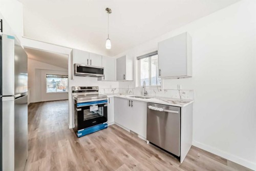 16218 Shawbrooke Road Sw, Calgary, AB - Indoor Photo Showing Kitchen With Stainless Steel Kitchen