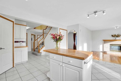 46 Somerset Close Sw, Calgary, AB - Indoor With Fireplace