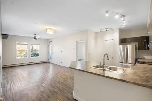 105-100 Cranfield Common Se, Calgary, AB - Indoor Photo Showing Kitchen With Double Sink