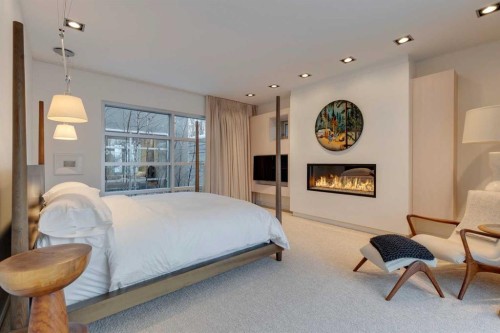 3033 1 Street Sw, Calgary, AB - Indoor Photo Showing Bedroom With Fireplace