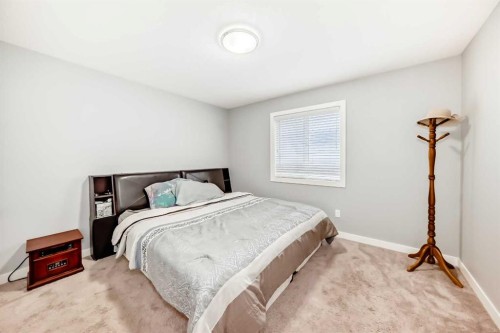 512 Baysprings Lane Sw, Airdrie, AB - Indoor Photo Showing Bedroom