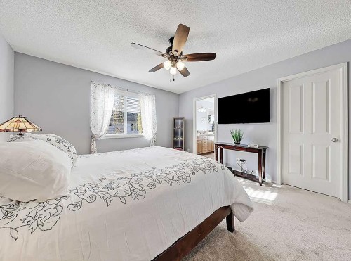 788 New Brighton Drive Se, Calgary, AB - Indoor Photo Showing Bedroom