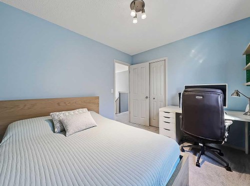 788 New Brighton Drive Se, Calgary, AB - Indoor Photo Showing Bedroom