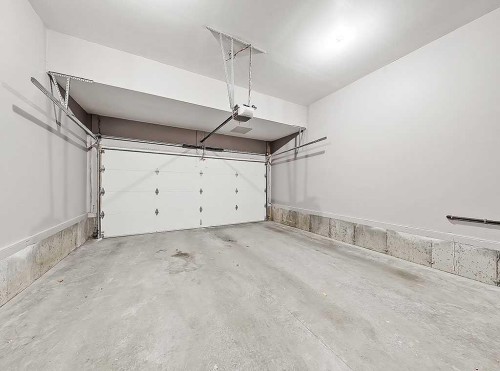 788 New Brighton Drive Se, Calgary, AB - Indoor Photo Showing Garage