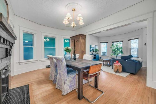2123 16 Street Sw, Calgary, AB - Indoor Photo Showing Dining Room With Fireplace