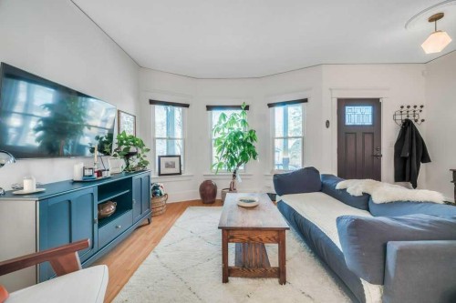 2123 16 Street Sw, Calgary, AB - Indoor Photo Showing Living Room With Fireplace