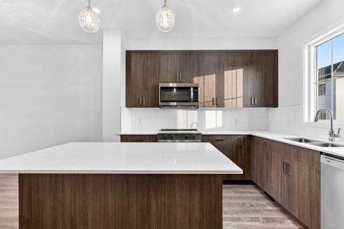 92 Creekside Drive Sw, Calgary, AB - Indoor Photo Showing Kitchen With Double Sink