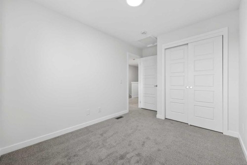 92 Creekside Drive Sw, Calgary, AB - Indoor Photo Showing Other Room