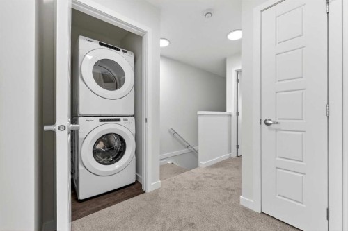 92 Creekside Drive Sw, Calgary, AB - Indoor Photo Showing Laundry Room