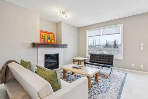 71 Walden Manor Se, Calgary, AB - Indoor Photo Showing Living Room With Fireplace