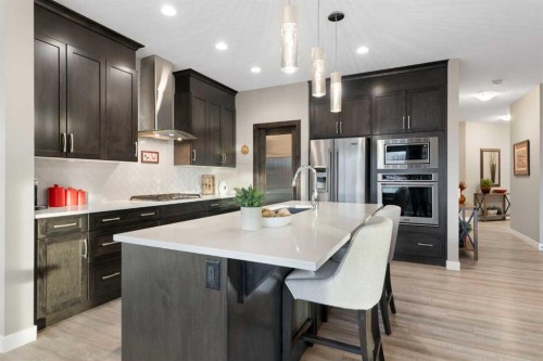 67 Fireside Terrace, Cochrane, AB - Indoor Photo Showing Kitchen With Upgraded Kitchen