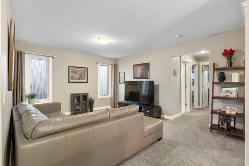 67 Fireside Terrace, Cochrane, AB - Indoor Photo Showing Living Room With Fireplace
