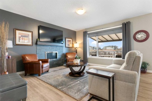 67 Fireside Terrace, Cochrane, AB - Indoor Photo Showing Living Room With Fireplace