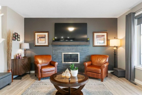 67 Fireside Terrace, Cochrane, AB - Indoor Photo Showing Living Room With Fireplace