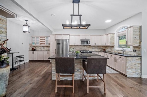 187 Gleneagles View, Cochrane, AB - Indoor Photo Showing Kitchen With Upgraded Kitchen