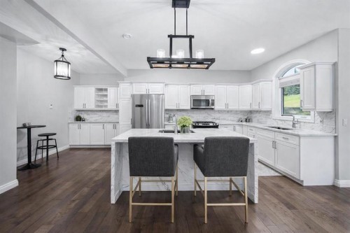 187 Gleneagles View, Cochrane, AB - Indoor Photo Showing Kitchen With Upgraded Kitchen