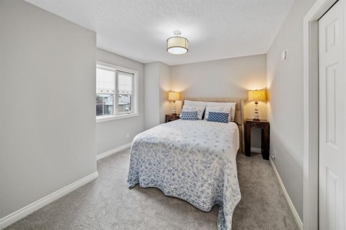 187 Gleneagles View, Cochrane, AB - Indoor Photo Showing Bedroom