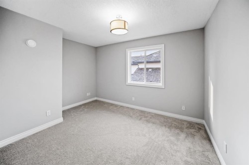 187 Gleneagles View, Cochrane, AB - Indoor Photo Showing Other Room