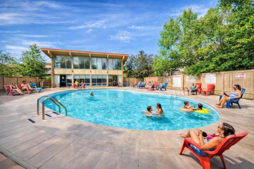 307-816 89 Avenue Sw, Calgary, AB - Outdoor With In Ground Pool With Deck Patio Veranda