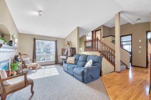 102 Parklane Drive, Strathmore, AB - Indoor Photo Showing Living Room With Fireplace