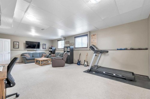 102 Parklane Drive, Strathmore, AB - Indoor Photo Showing Gym Room