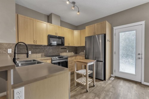106 Ranch Ridge Meadow, Strathmore, AB - Indoor Photo Showing Kitchen With Double Sink