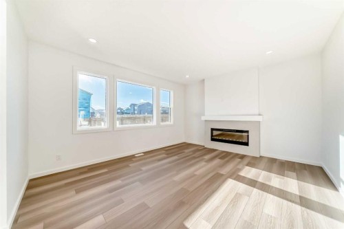 63 Creekside Path Sw, Calgary, AB - Indoor Photo Showing Living Room With Fireplace