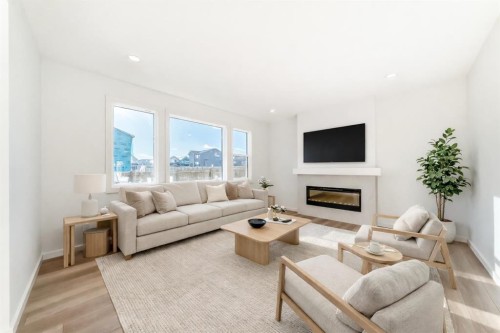 63 Creekside Path Sw, Calgary, AB - Indoor Photo Showing Living Room With Fireplace