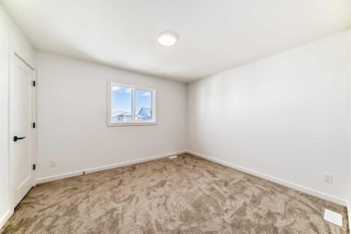 63 Creekside Path Sw, Calgary, AB - Indoor Photo Showing Other Room