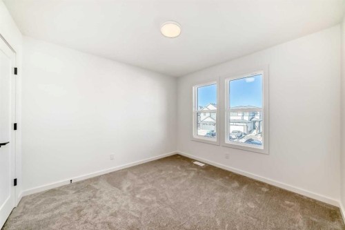 63 Creekside Path Sw, Calgary, AB - Indoor Photo Showing Other Room