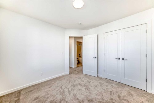 63 Creekside Path Sw, Calgary, AB - Indoor Photo Showing Other Room