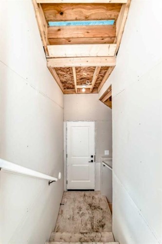 63 Creekside Path Sw, Calgary, AB - Indoor Photo Showing Other Room