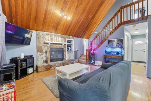 1429 Big Springs Way Se, Airdrie, AB - Indoor With Fireplace