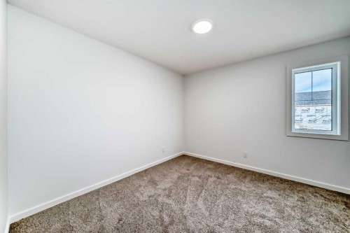 44 Creekside Path Sw, Calgary, AB - Indoor Photo Showing Other Room