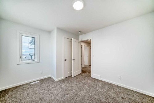 44 Creekside Path Sw, Calgary, AB - Indoor Photo Showing Other Room