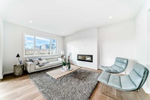 44 Creekside Path Sw, Calgary, AB - Indoor Photo Showing Living Room With Fireplace