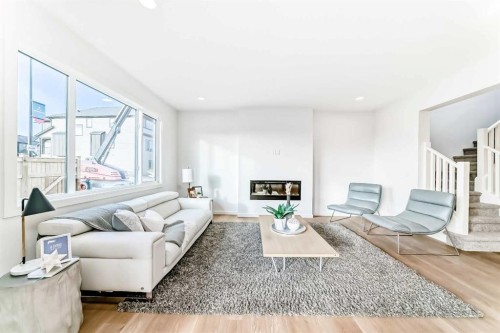 44 Creekside Path Sw, Calgary, AB - Indoor Photo Showing Living Room With Fireplace