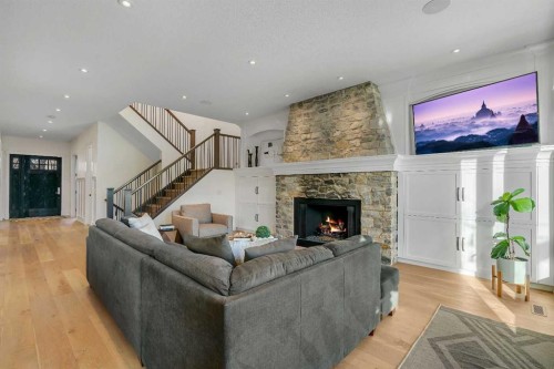 5852 Bowwater Crescent Nw, Calgary, AB - Indoor Photo Showing Living Room With Fireplace
