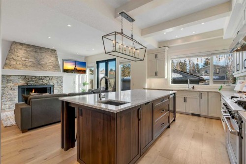 5852 Bowwater Crescent Nw, Calgary, AB - Indoor Photo Showing Kitchen With Fireplace With Upgraded Kitchen