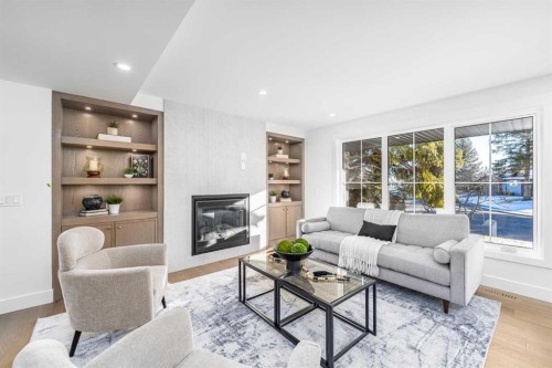 1152 Lake Sundance Crescent Se, Calgary, AB - Indoor Photo Showing Living Room With Fireplace