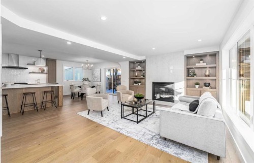 1152 Lake Sundance Crescent Se, Calgary, AB - Indoor Photo Showing Living Room With Fireplace