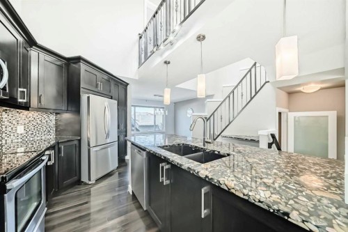 48 Auburn Bay Crescent Se, Calgary, AB - Indoor Photo Showing Kitchen With Stainless Steel Kitchen With Double Sink With Upgraded Kitchen