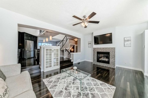 48 Auburn Bay Crescent Se, Calgary, AB - Indoor Photo Showing Living Room With Fireplace