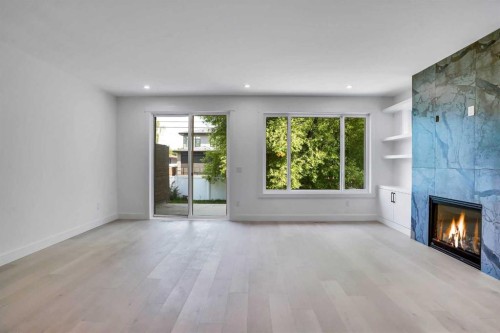 602 25 Avenue, Calgary, AB - Indoor Photo Showing Living Room With Fireplace