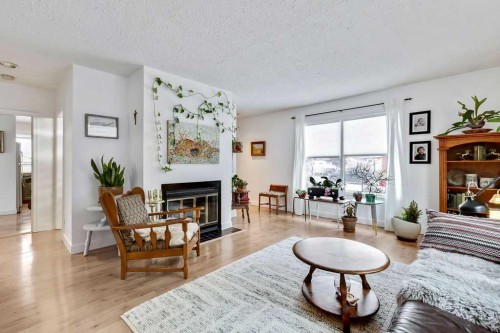 411 Mountain View Place, Longview, AB - Indoor Photo Showing Living Room With Fireplace