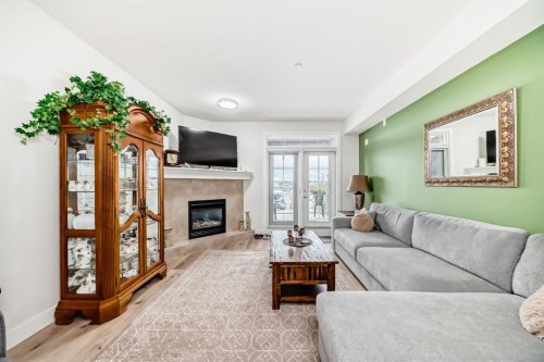 111-1005B Westmount Drive, Strathmore, AB - Indoor Photo Showing Living Room With Fireplace