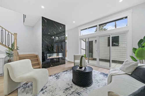 107 Hartford Road Nw, Calgary, AB - Indoor Photo Showing Living Room With Fireplace